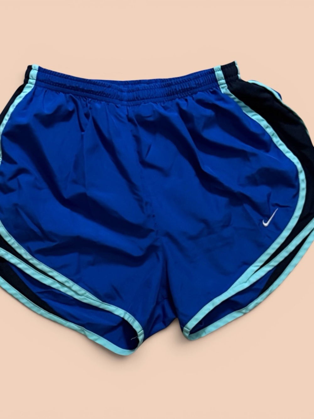 Nike Royal Blue Athletic Shorts with turquoise Trim.
